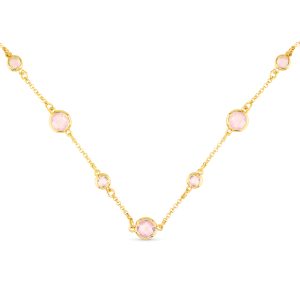 Gold necklace with different shaped circular pink pendants spaced throughout the necklace