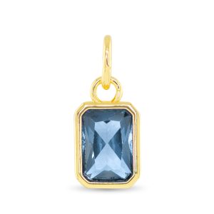 gold pendent with a blue stone
