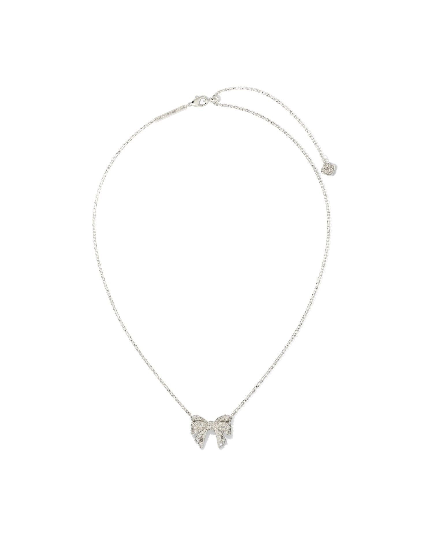 Silver(rhodium) chain necklace with bow pendant. Bow is cover is crystals and small pearls . Lobster clasp with adjustable slider bead.