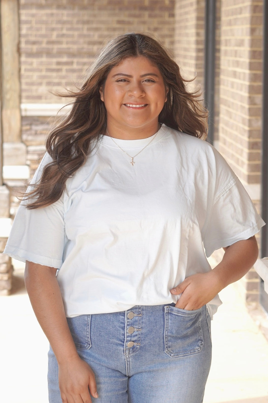 baby blue t-shirt, crew neckline, short sleeve, hem detail on the sleeve and bottom. 
