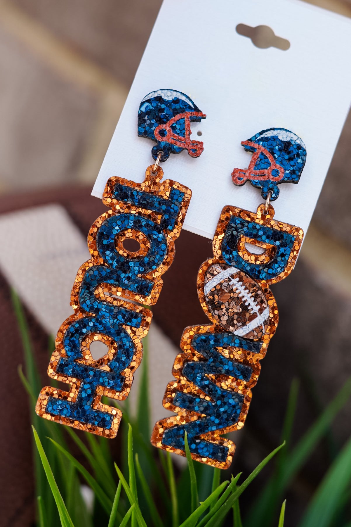 Orange outline "Touch" and "Down" earrings with blue wording. Blue beaded helmets.