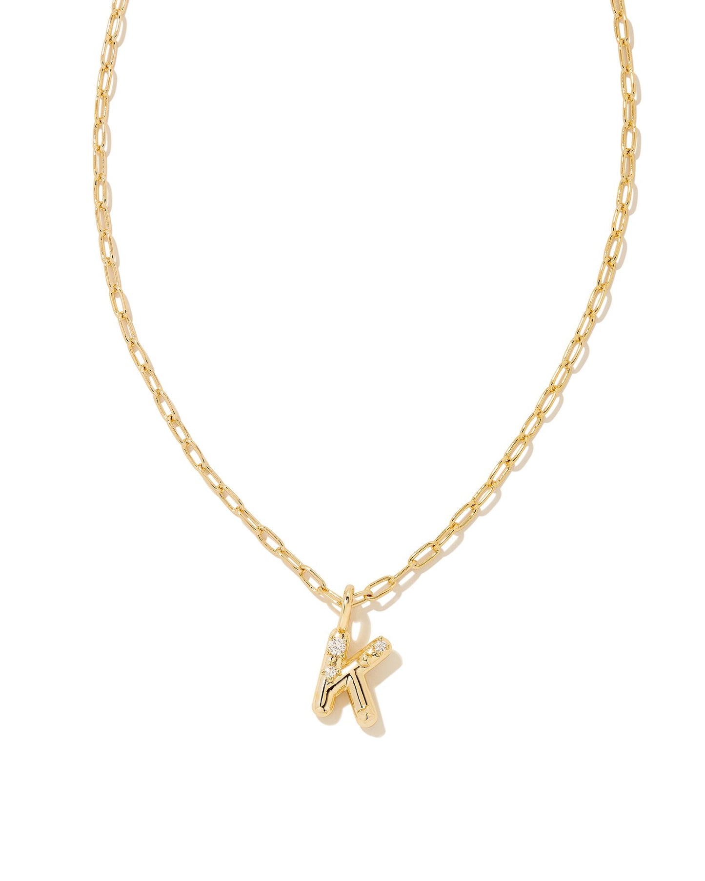 Personalize your everyday look with the Crystal Letter Short Pendant Necklace in White Crystal. Whether you’re rocking your initial or a loved one’s, this sentimental layer is one you’ll keep coming back to again and again.  Dimensions- 16' CHAIN WITH 3' EXTENDER, 0.62'L X 0.35"W PENDANT Metal- 14K Gold plated over brass Closure- Lobster Clasp Material-   White CZ Letter K