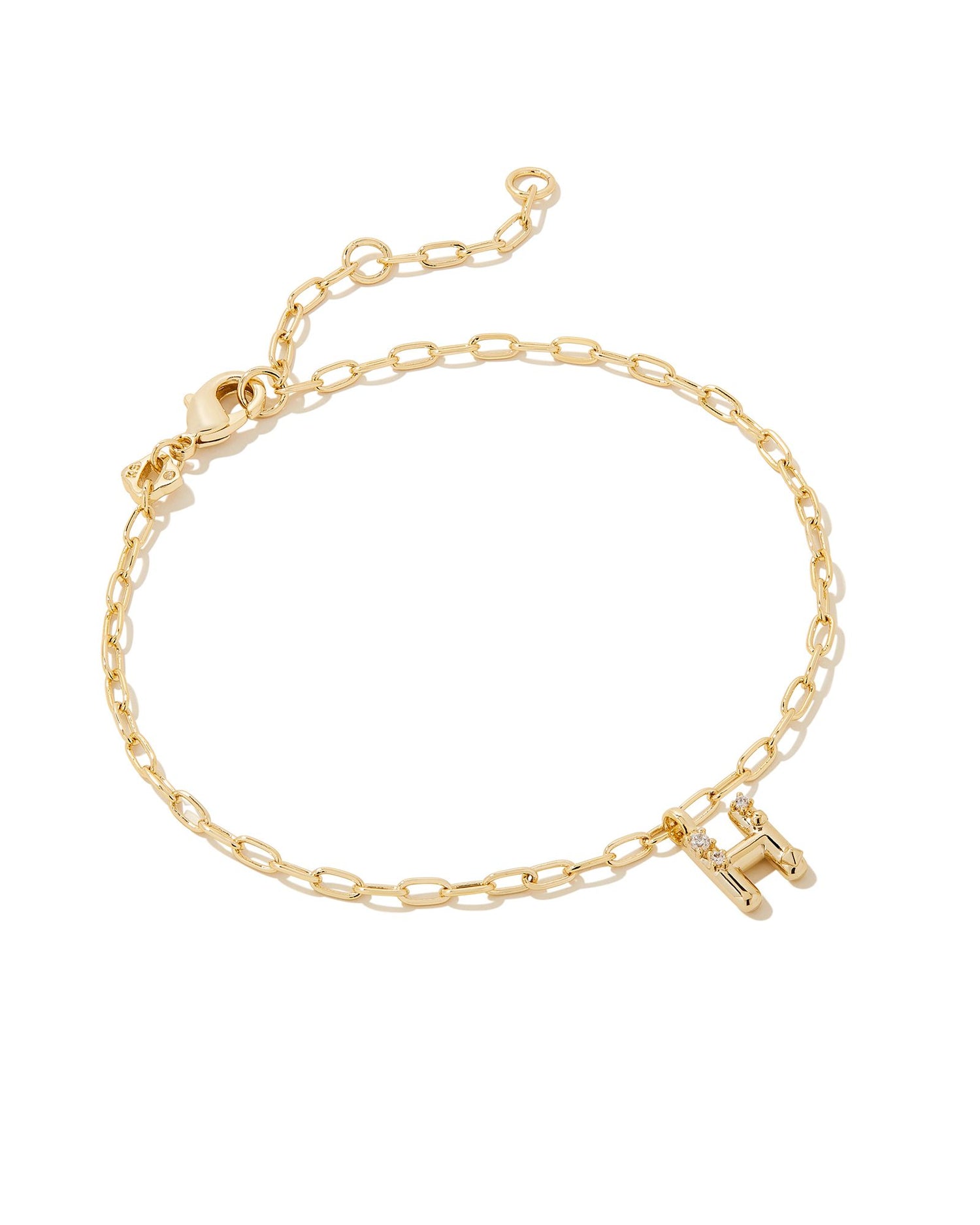 Add a personal touch to your wrist stack with the Crystal Delicate Chain Bracelet in White Crystal, our first Fashion Jewelry initial bracelet. Featuring a dainty chain and letter charm with a hint of sparkle, this bracelet is the perfect way to celebrate the ones you love—including yourself!  Dimensions- 6.5' CHAIN WITH 1.5' EXTENDER, 0.45'L X 0.26"W PENDANT Metal- 14K Gold plated over brass Closure- Lobster Clasp Material-  White CZ Letter H