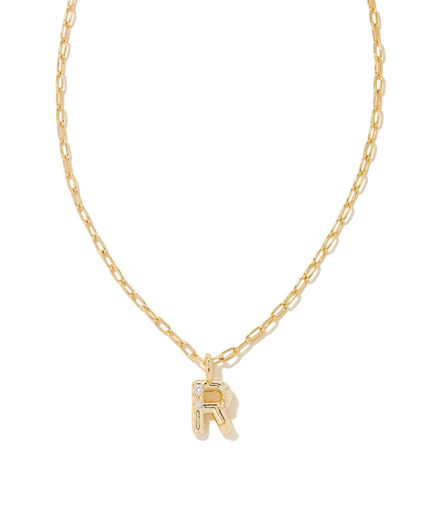 Personalize your everyday look with the Crystal Letter Short Pendant Necklace in White Crystal. Whether you’re rocking your initial or a loved one’s, this sentimental layer is one you’ll keep coming back to again and again.  Dimensions- 16' CHAIN WITH 3' EXTENDER, 0.62'L X 0.35"W PENDANT Metal- 14K Gold plated over brass Closure- Lobster Clasp Material-   White CZ Letter R