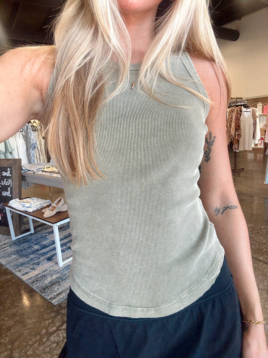 Women wearing a ribbed sage tank, fitted style and a round neckline.