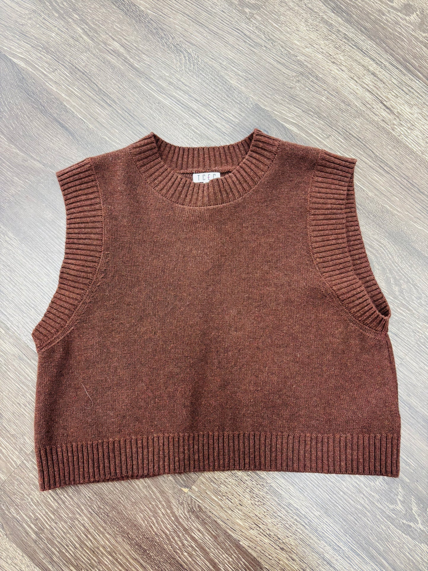 brown cropped relaxed fit sleeveless top paired 