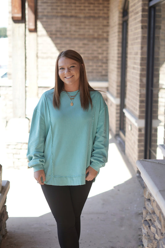 Spice up with wardrobe with the Riley Replay Sweatshirt. Its bright tide pool color and reverse raw cut seam detailing makes for the perfect top to lounge around the house in or even some quick run errands before starting your work week!