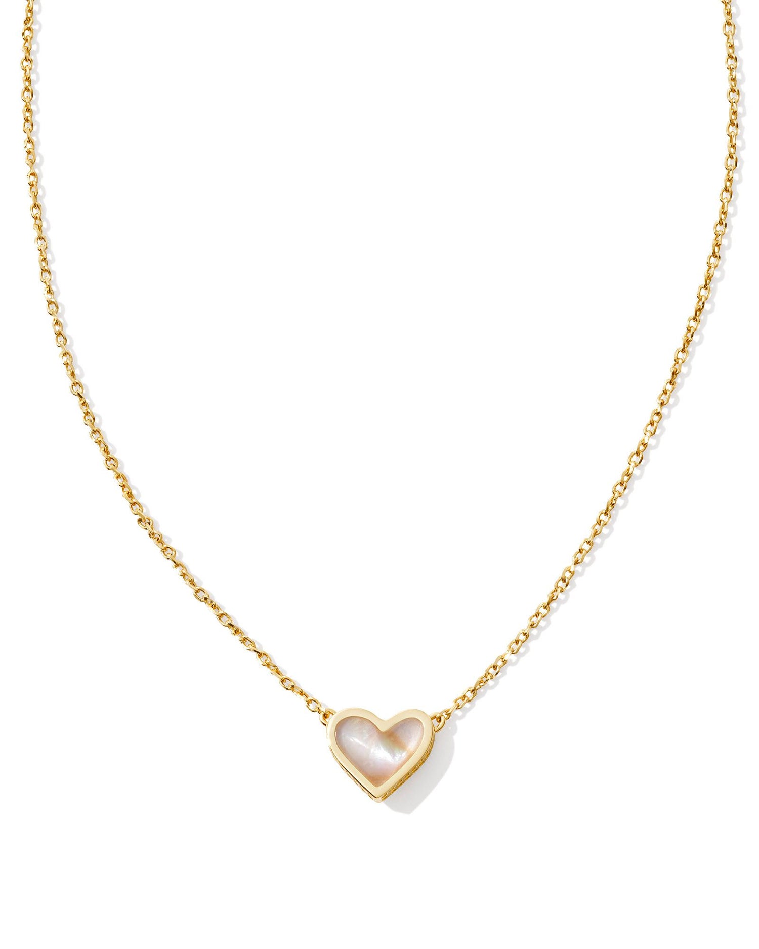 gold necklace with heart pendant that has an iridescent abalone stone center