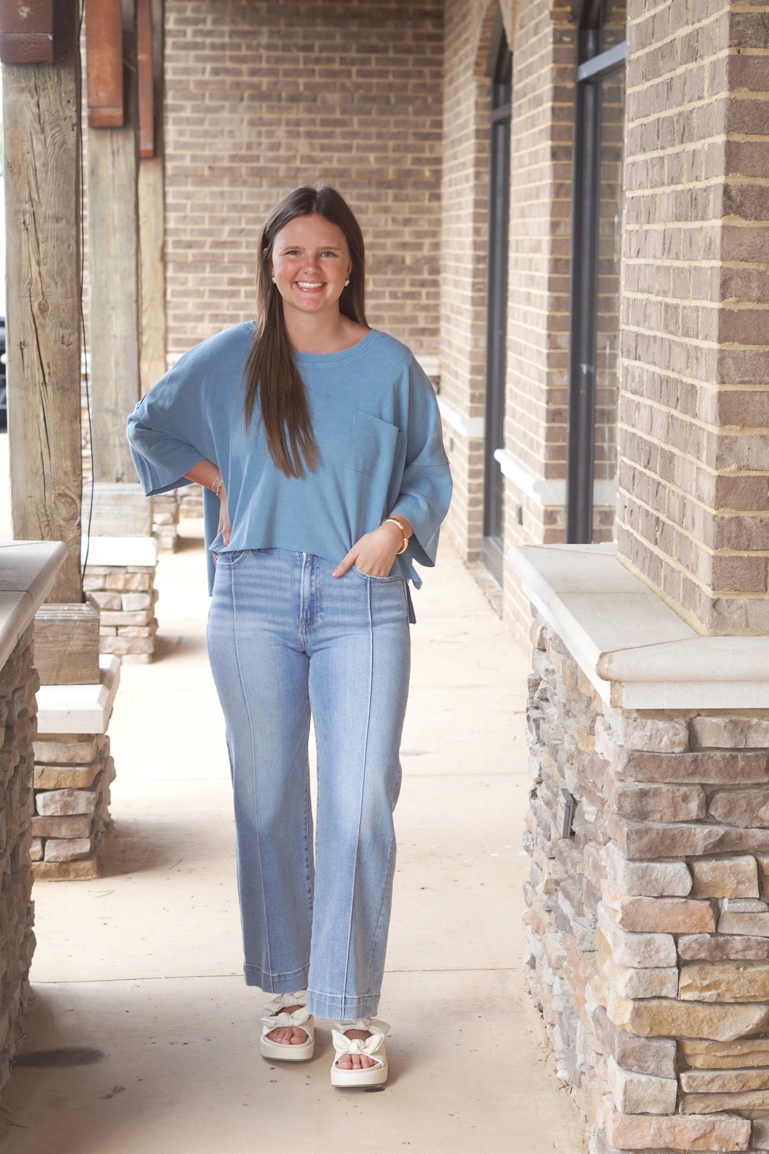 blue short sleeve pocket tee, round neckline, cropped, relaxed fit. 