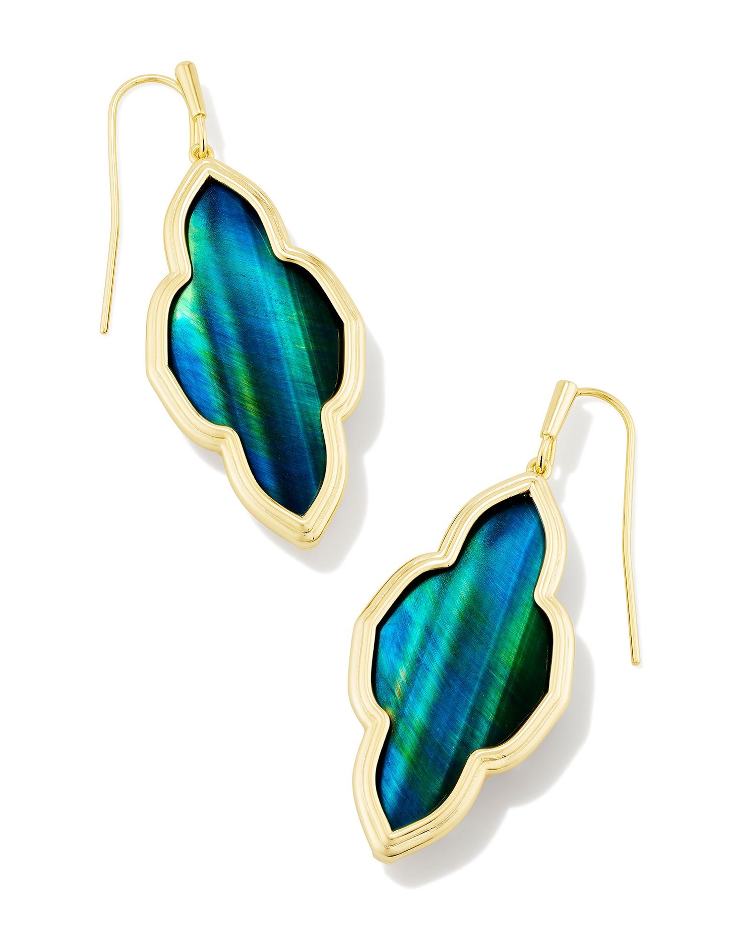 A celebration of our signature medallion logo, the Framed Abbie Gold Drop Earrings are a glam take on the everyday drop style. A gorgeous stone is paired with a sleek metal frame, creating earrings that complement any and every face shape. Teal Tiger's Eye