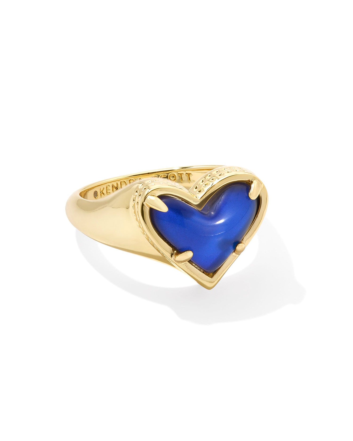 gold heart band ring with a moon stone center