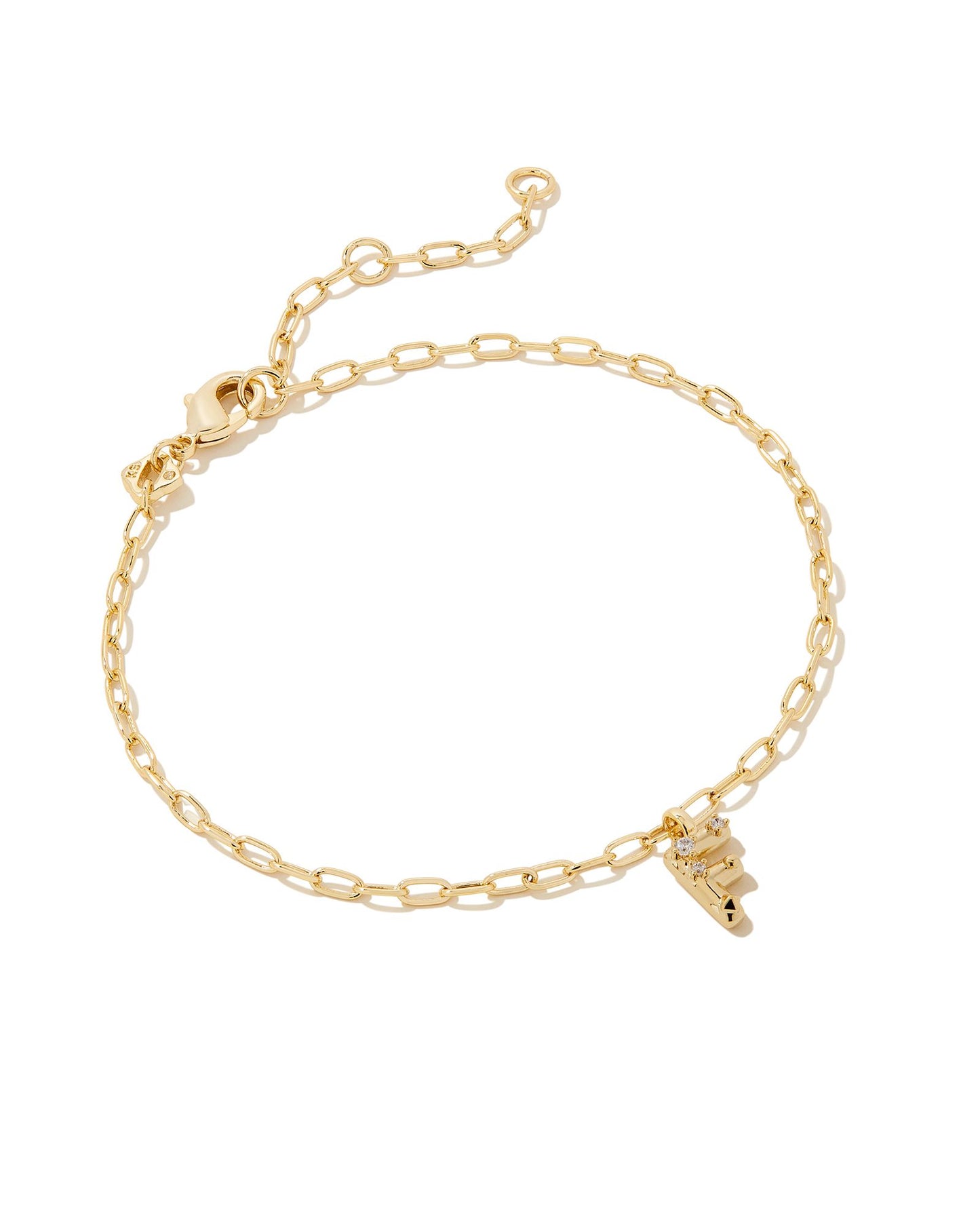  Add a personal touch to your wrist stack with the Crystal Delicate Chain Bracelet in White Crystal, our first Fashion Jewelry initial bracelet. Featuring a dainty chain and letter charm with a hint of sparkle, this bracelet is the perfect way to celebrate the ones you love—including yourself!  Dimensions- 6.5' CHAIN WITH 1.5' EXTENDER, 0.45'L X 0.26"W PENDANT Metal- 14K Gold plated over brass Closure- Lobster Clasp Material-  White CZ Letter F