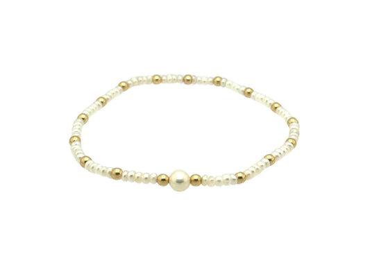 Gold Filled Bracelet With Pearl BALL BEAD MATERIALS: 14K GOLD FILLED, STERLING SILVER OR ROSE GOLD BEAD SIZE: 3MM | FRESHWATER PEARLS 5MM STRETCHY LENGTH: 6.5" OR 7" CLASP LENGTH: 6" + 1.5" EXTENSION HIGH PERFORMANCE ELASTIC MADE IN MIAMI, MADE WITH LOVE