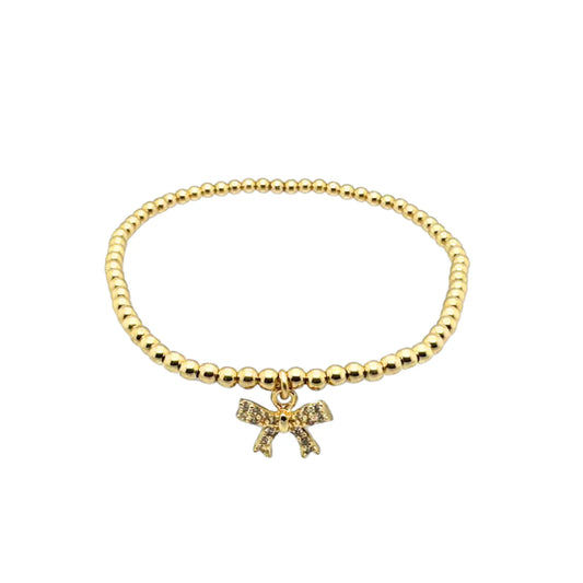 gold beaded bracelet with bow charm