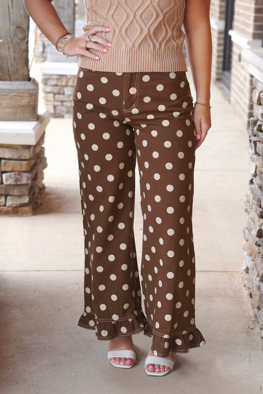 Brown pants with cream polk dots and a ruffled hem. 

Polka Detail All Around