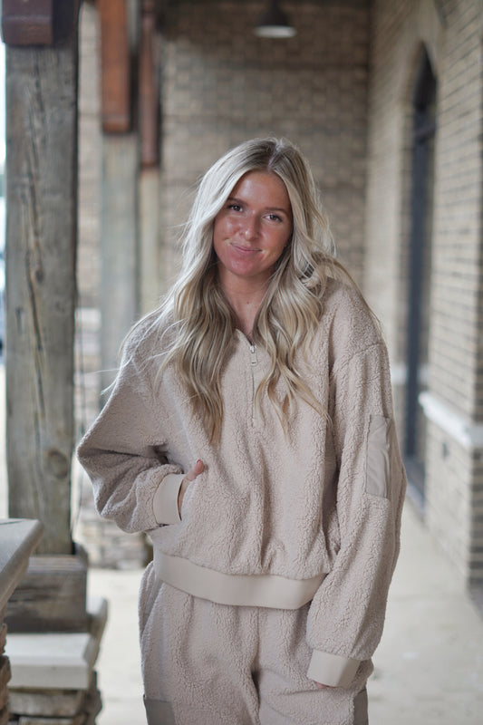 The Teddy Sherpa Quarter Zip will keep you cozy and warm all Fall and Winter long! Wear this staple piece with leggings and one of our platform slippers or pair it with its matching pants, the Teddy Sherpa Joggers!