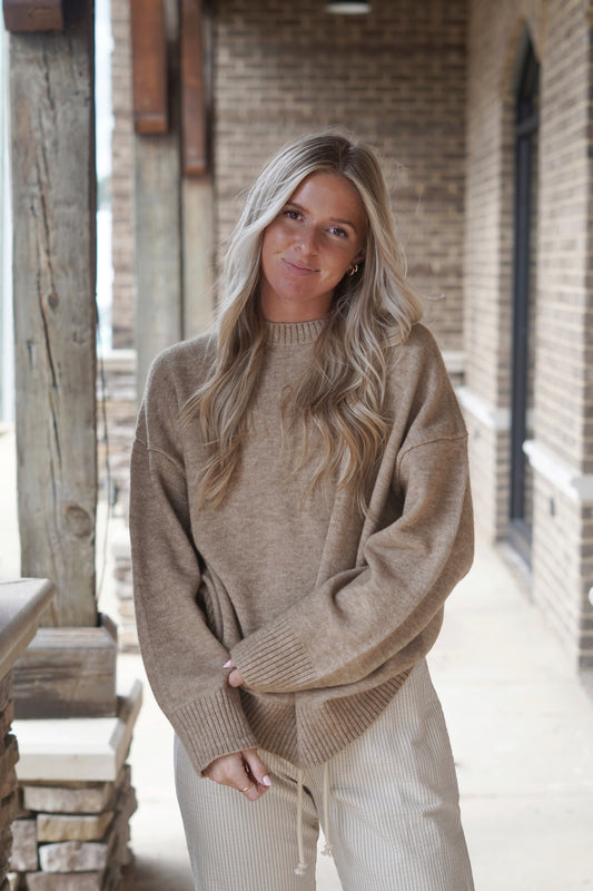 The Olivia Oversized Mocha Knit Sweater is a Fall essential! Pair this with oversized jeans or leggings for a cozy look! This Mocha sweater is the perfect neutral for Fall.