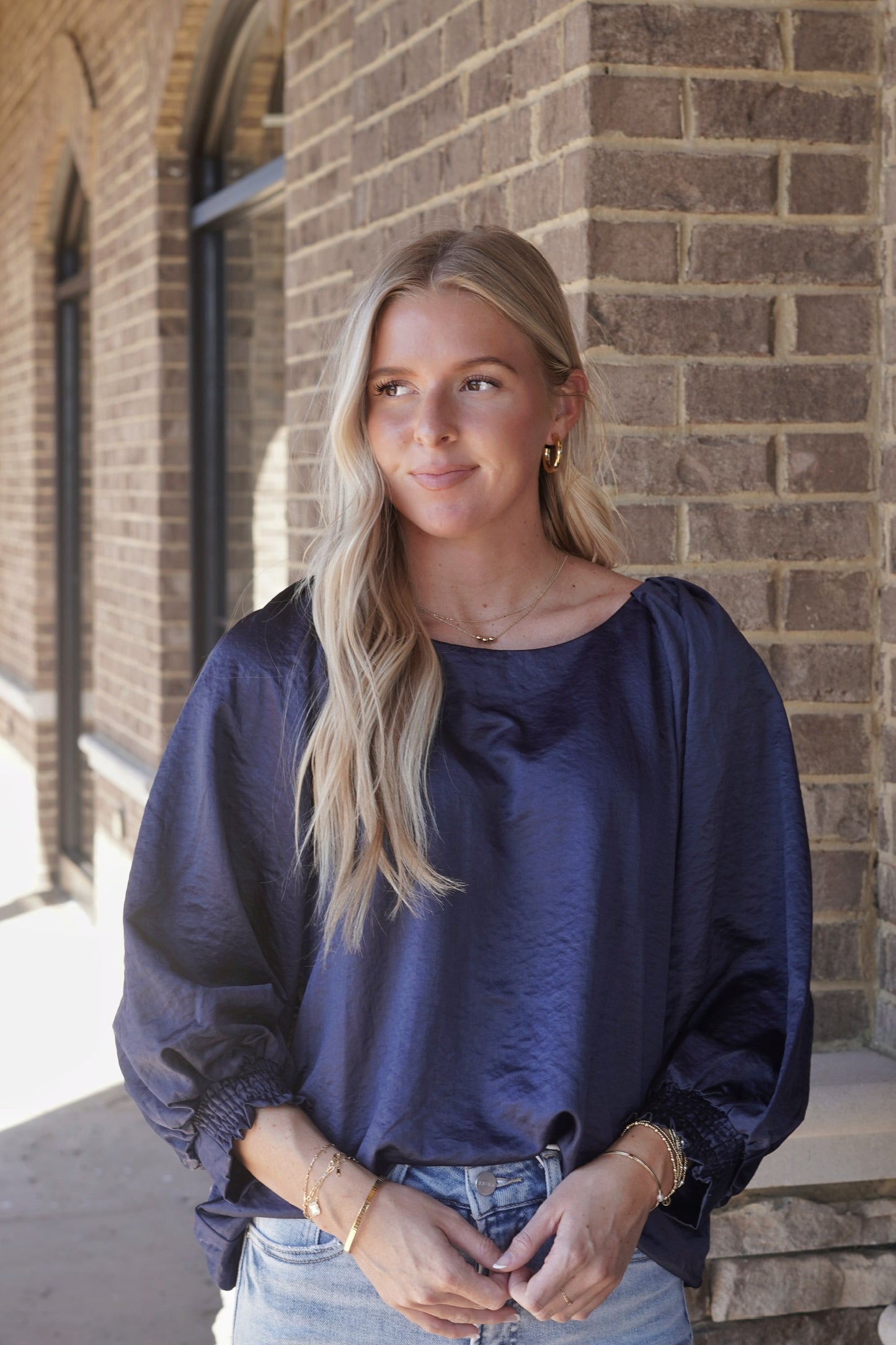 Midnight Blue Blouse, Round Neckline, Three Quarter Length Puff Sleeves, Relaxed Fit, Cinched Bottom of Sleeves
Color: Midnight
Fabric Content: 100% Polyester