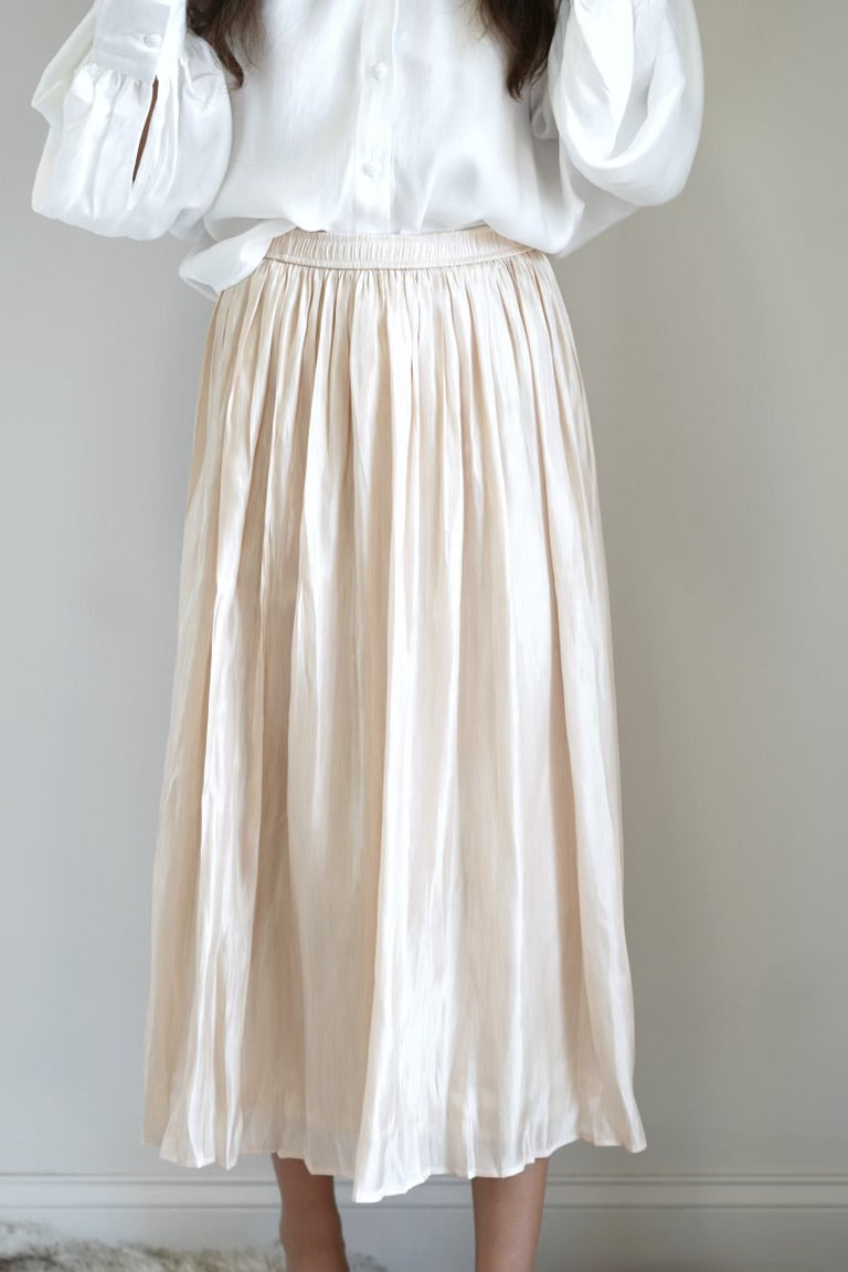 Dreamy Flowy Satin Skirt Elastic Waistband Crinkled Skirt Colors:  Vanilla Gold Midi Skirt Length Flowy Fit 100% Polyester Lining, 100% Polyester.
