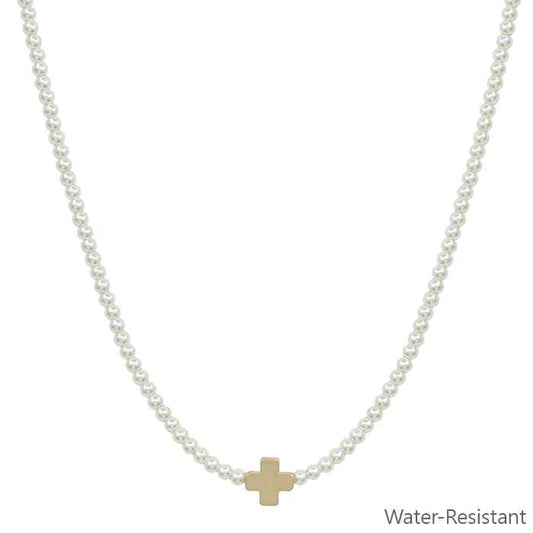 beaded pearl necklace with a gold cross pendent