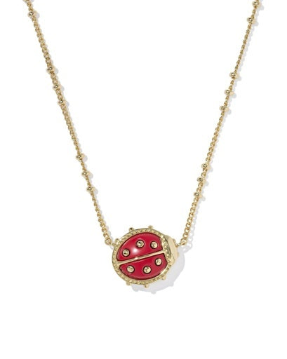 gold necklace with red and gold ladybug pendant
