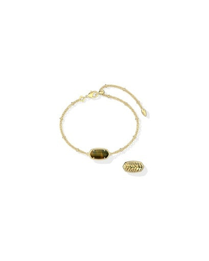 A delicate gold chain bracelet featuring a central oval faceted gemstone and a small textured leaf-shaped charm, displayed on a clean white background.