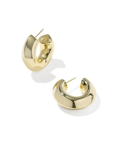 Gold hoop earrings with white accents on a white background
