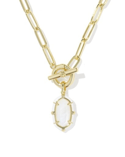A gold paperclip chain necklace with a toggle clasp and a dangling oval bezel-set white stone pendant, shown on a clean white background.