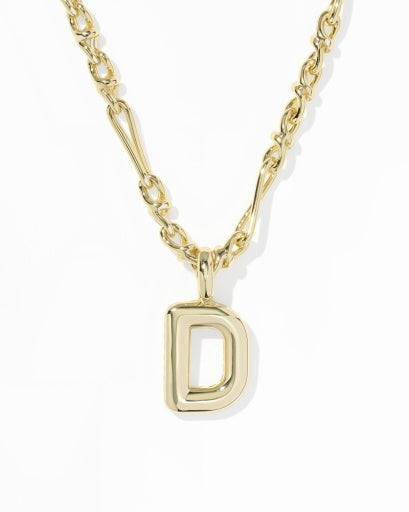 A gold initial necklace featuring a polished letter 'D' pendant on a twisted link chain, shown against a plain white background.