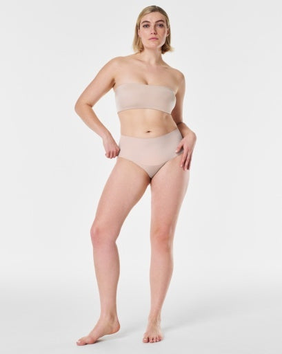 Model wearing a Strapless Bra that offers comfortability and support, in the color Light Beige