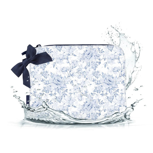 Floral-patterned pouch with a navy ribbon on a white background