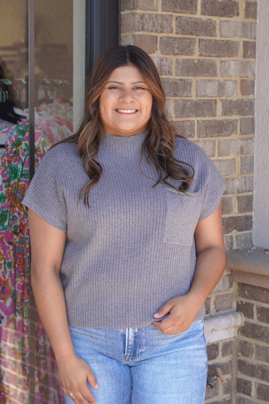 A short-sleeve ribbed knit mock neck sweater in a dusty lavender-gray color