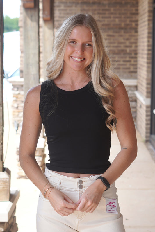 Women Wearing a Black Ribbed Tank, Sleeveless, Round Neckline.