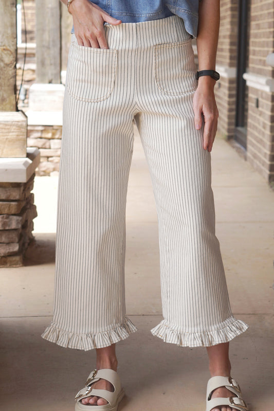 Ivory jeans with Pinstripe, a Ruffle hem, and Front Pockets.