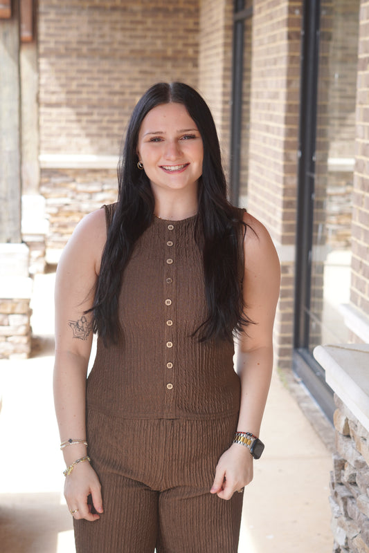 Women wearing a Textured Brown Button Down Top, Round Neckline, Sleeveless, Knit Material. 