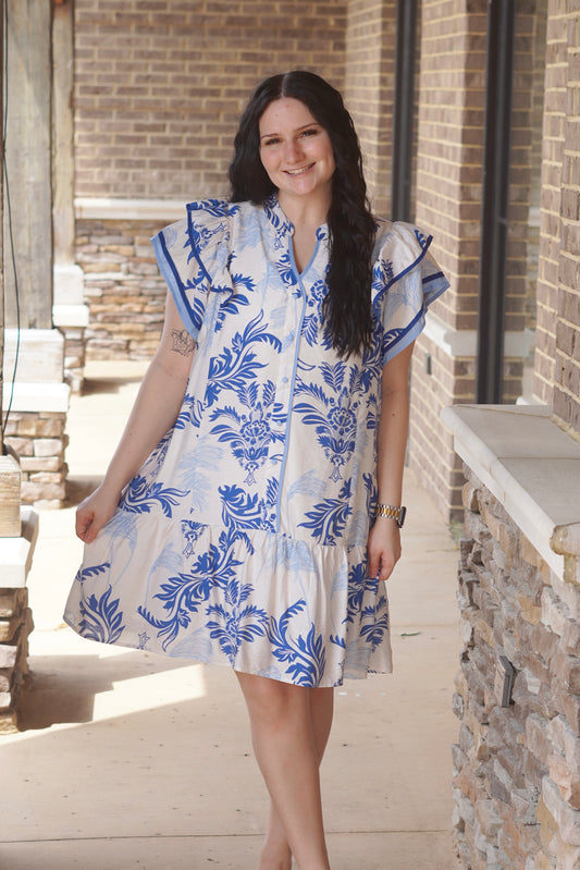 Women Wearing a Blue Floral Dress, V-Neckline, Ruffle Sleeves, Mid Thigh Length, Button Down