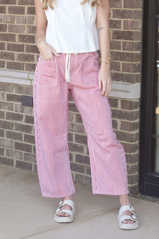 red and white pinstripes wide leg jeans, front pockets, drawstring belt.
