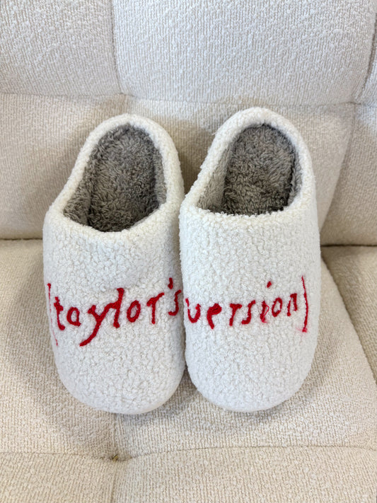 White House slippers with "Taylor version" written in red 