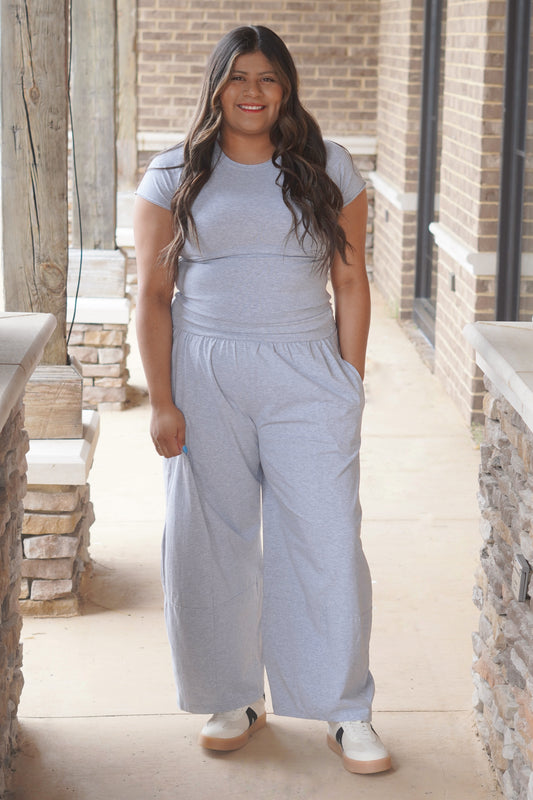 Women wearing Heather Grey Wide Leg Pants, With an Elastic waist band. 