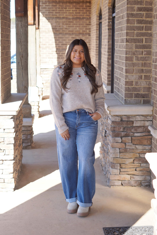 Beige Sweater with Floral Embroidery Detailing around the Collar, Long Sleeve, Full Length - Paired with Medium Wash Jeans and Boots