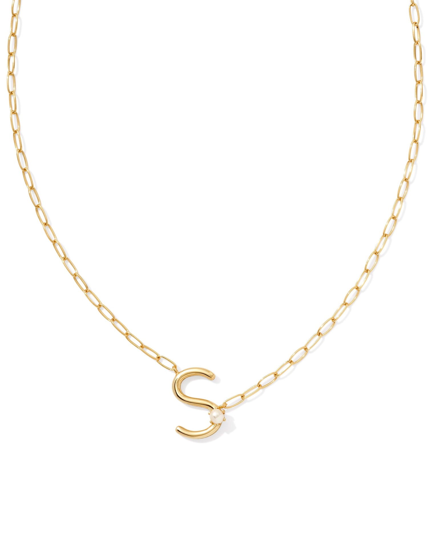 gold necklace with an initial pendant that has a singular pearl stud on it. initial S