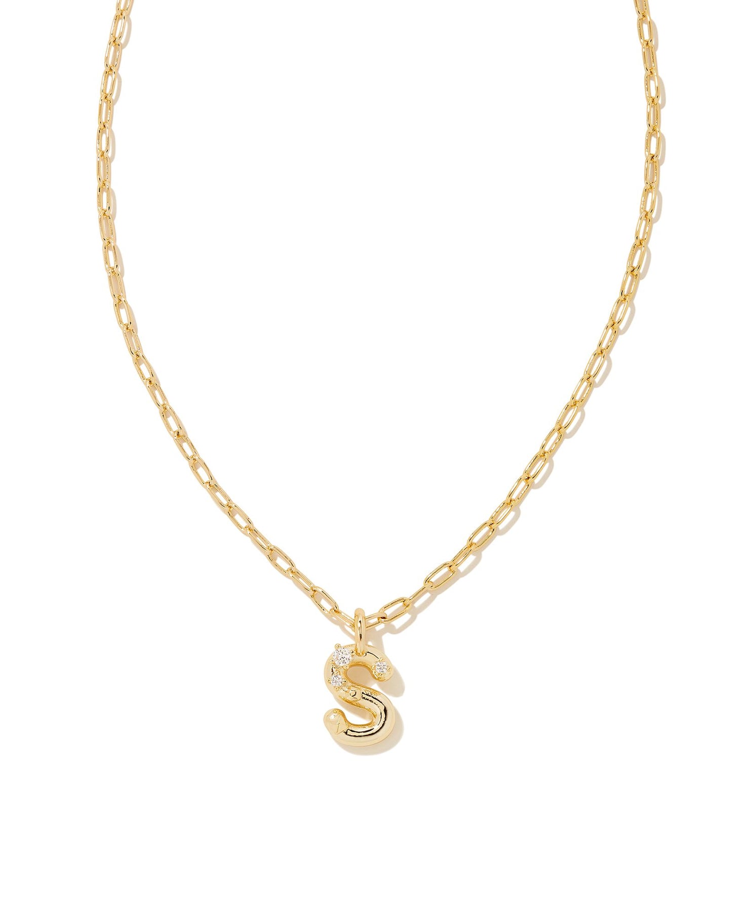 Personalize your everyday look with the Crystal Letter Short Pendant Necklace in White Crystal. Whether you’re rocking your initial or a loved one’s, this sentimental layer is one you’ll keep coming back to again and again.  Dimensions- 16' CHAIN WITH 3' EXTENDER, 0.62'L X 0.35"W PENDANT Metal- 14K Gold plated over brass Closure- Lobster Clasp Material-   White CZ Letter S