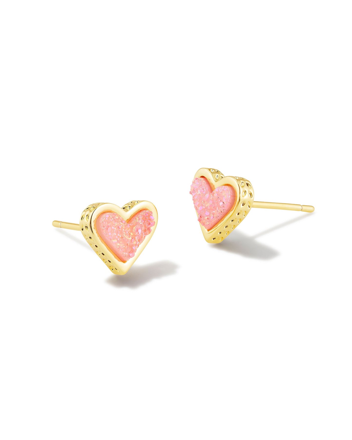 It’s only a matter of time before you fall for the Framed Ari Heart Gold Studs. A slightly updated version of our fan-favorite silhouette, these studs feature a smaller heart shape and a sleek metal frame embellished with our signature hoofprint detailing. Fun, flirty, and feminine, these sweet heart earrings are always a good idea. Gold Light Pink Drusy