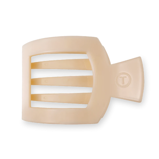 Unwind and relax with the new TELETIES Flat Square Hair Clip! Designed with our same innovative material that is nearly unbreakable, this clip is perfect for lying down, doing yoga or simply laying back without discomfort.&nbsp;The large size is great for thick hair and is 4.1 inches long. Almond Beige