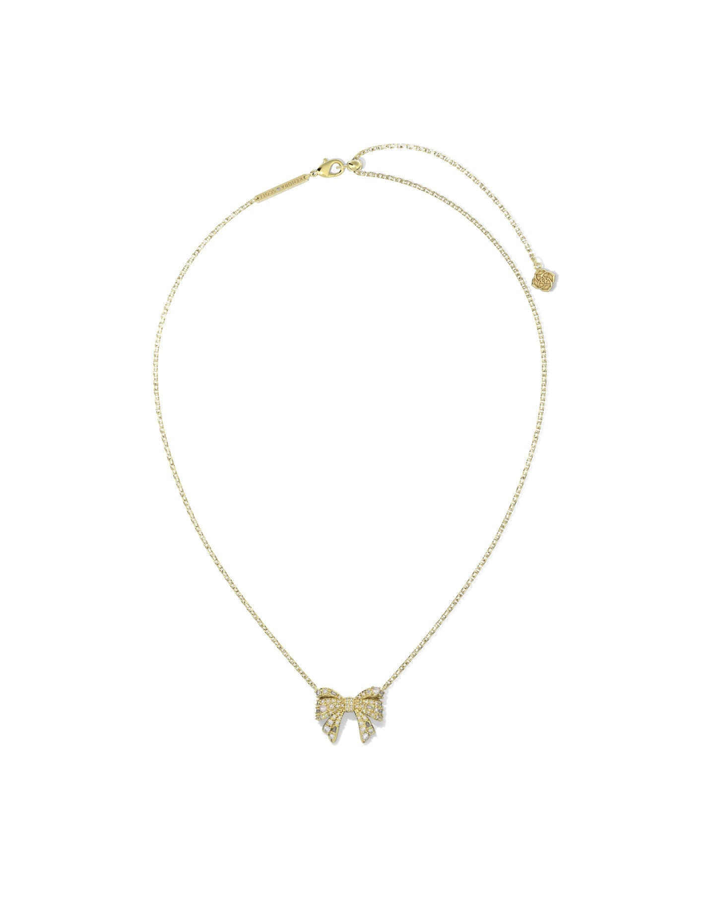 Gold chain necklace with bow pendant. Bow is cover is crystals and small pearls . Lobster clasp with adjustable slider bead.