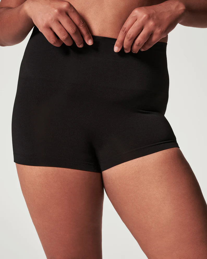 Spanx EcoCare Boyshort Full coverage, front and back Black Rise: 27”,Inseam: ¾” Shaping waistband with seamless comfort doesn’t dig 89% Nylon, 10% Elastane, 1% Cotton Care: Machine Wash Cold, Gentle Cycle. Only Non-Chlorine Bleach When Needed. Lay Flat To Dry. Do Not Iron.