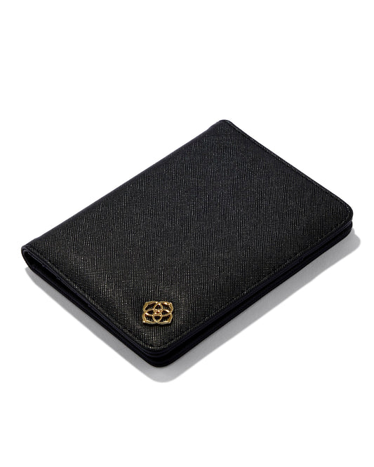 black faux leather passport holder with gold Kendra Scott flower, opens up to multiple card sleeves