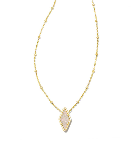 With its satellite chain, unique faceting, and eye-catching stone, the Kinsley Gold Short Pendant Necklace in Iridescent Drusy is a contemporary refresh on the beloved pendant necklace style. Featuring a custom diamond-cut stone, this pendant adds some elevated edge to any layered look.