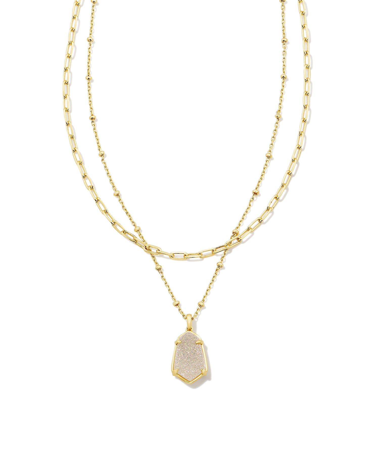 Double up on the glamour with the Alexandria Gold Multi Strand Necklace. A fresh take on our classic Alex silhouette, you can’t go wrong when you wear this two-in-one necklace with a link-style chain, paired with a striking stone pendant on a satellite chain. Iridescent drusy