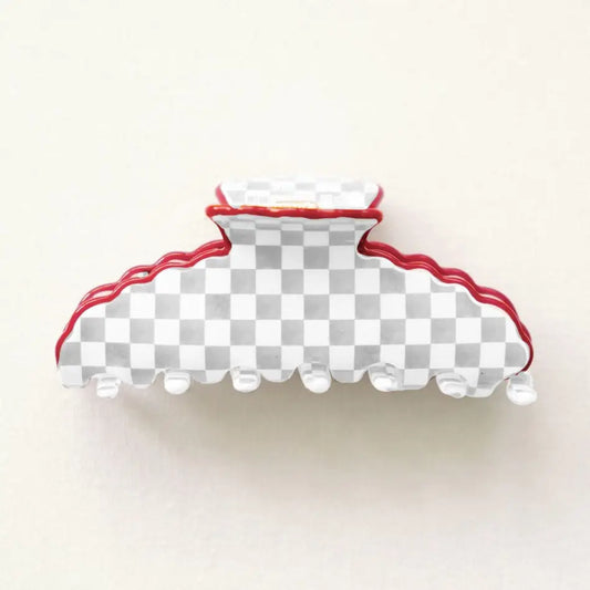 Hair clip with checkered pattern and red accents on a white background
